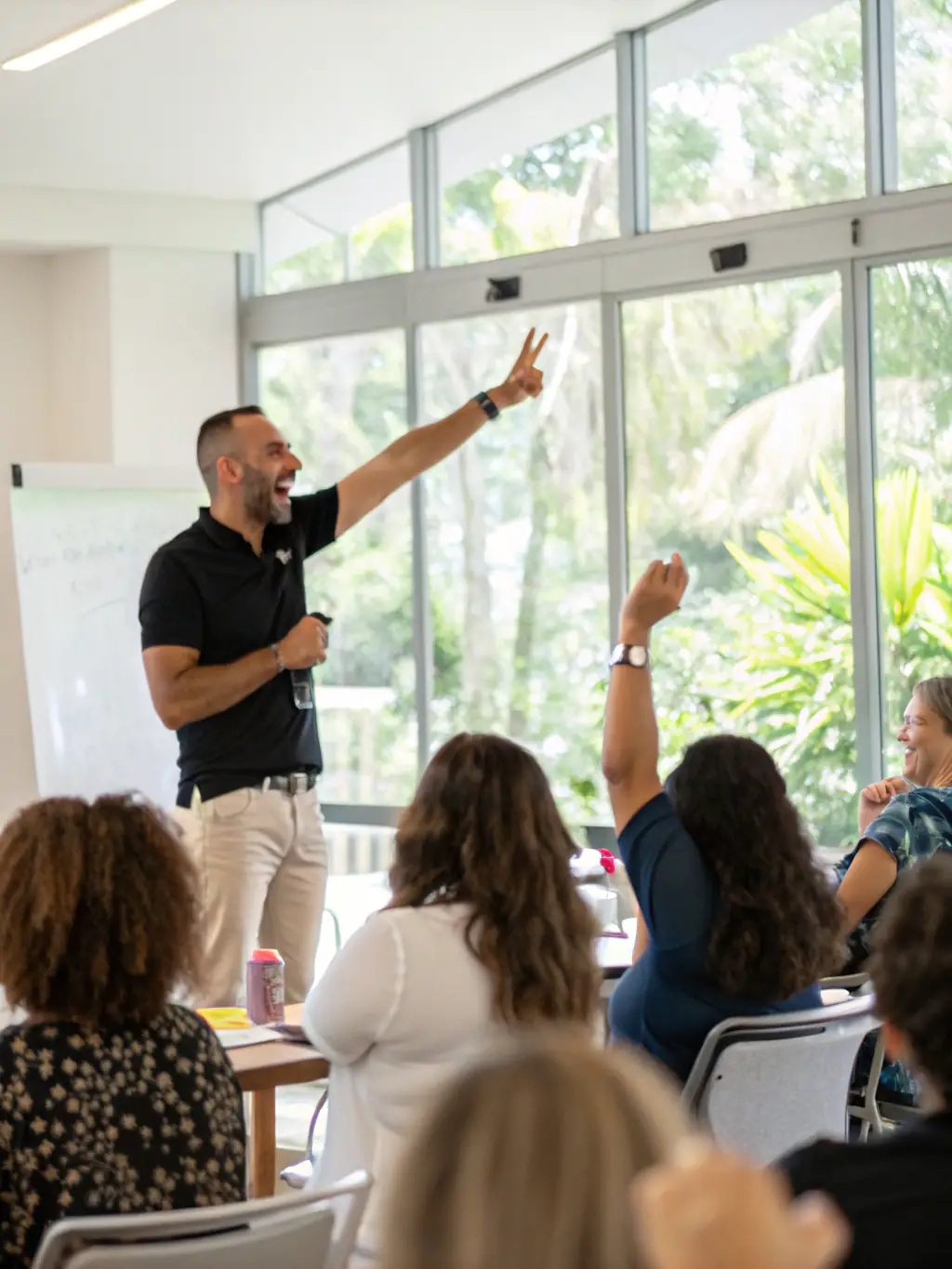 A coach facilitating a workshop on scaling strategies, with participants actively engaged in discussions and problem-solving exercises.